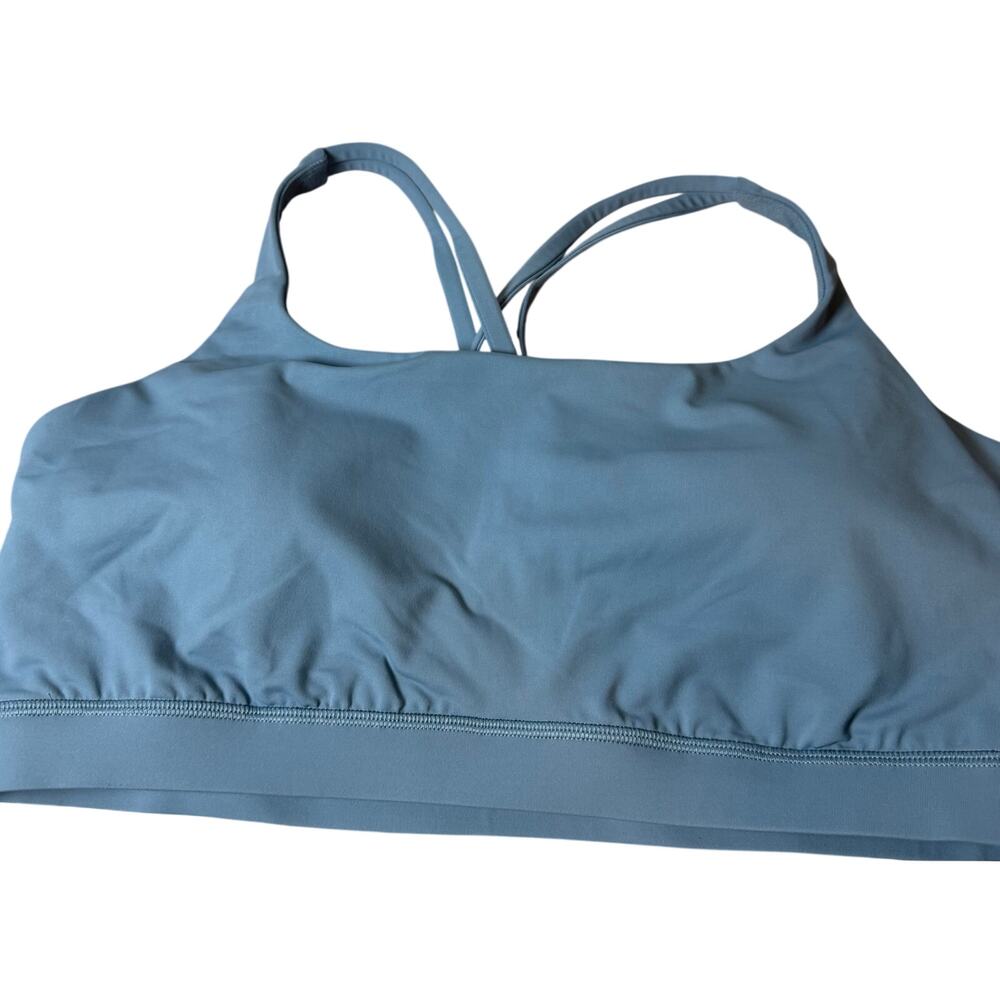 Lululemon Wunder Train Mesh-Back sports bra in a light blue color.